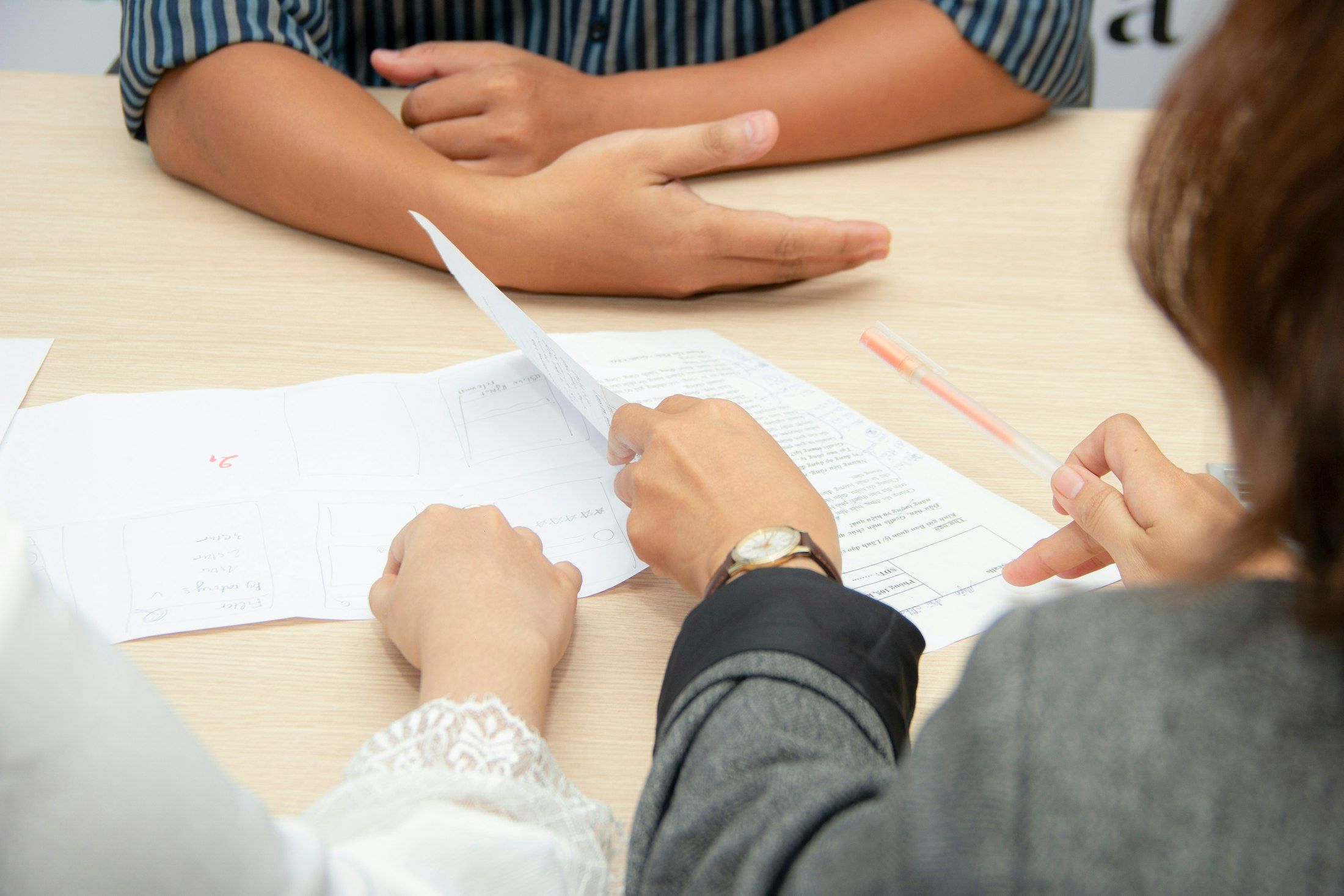 Monetaire accountant reviewing documents with a client in Worthing