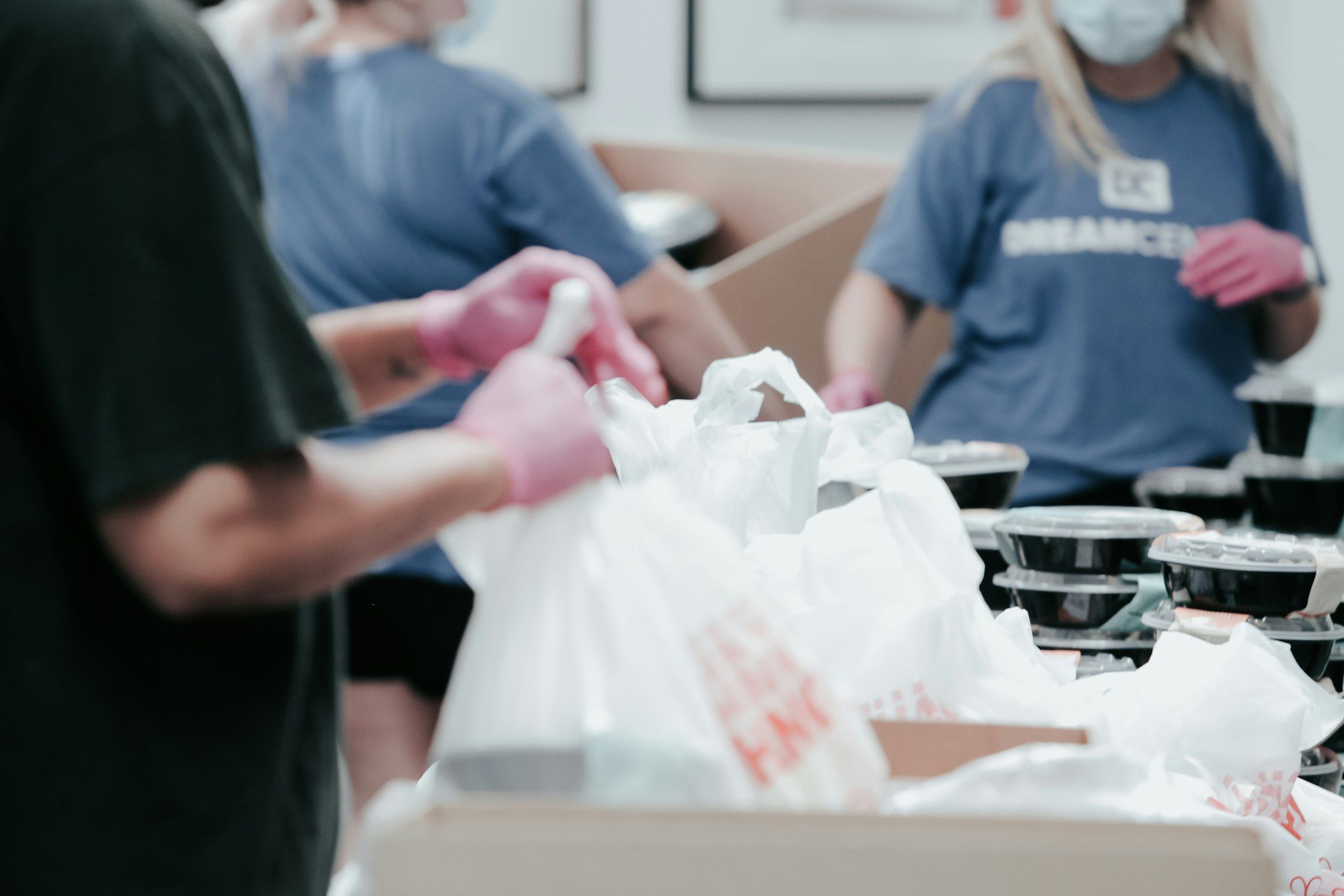 Charity volunteers packing donations, supported by Monetaire charity accountants in Worthing