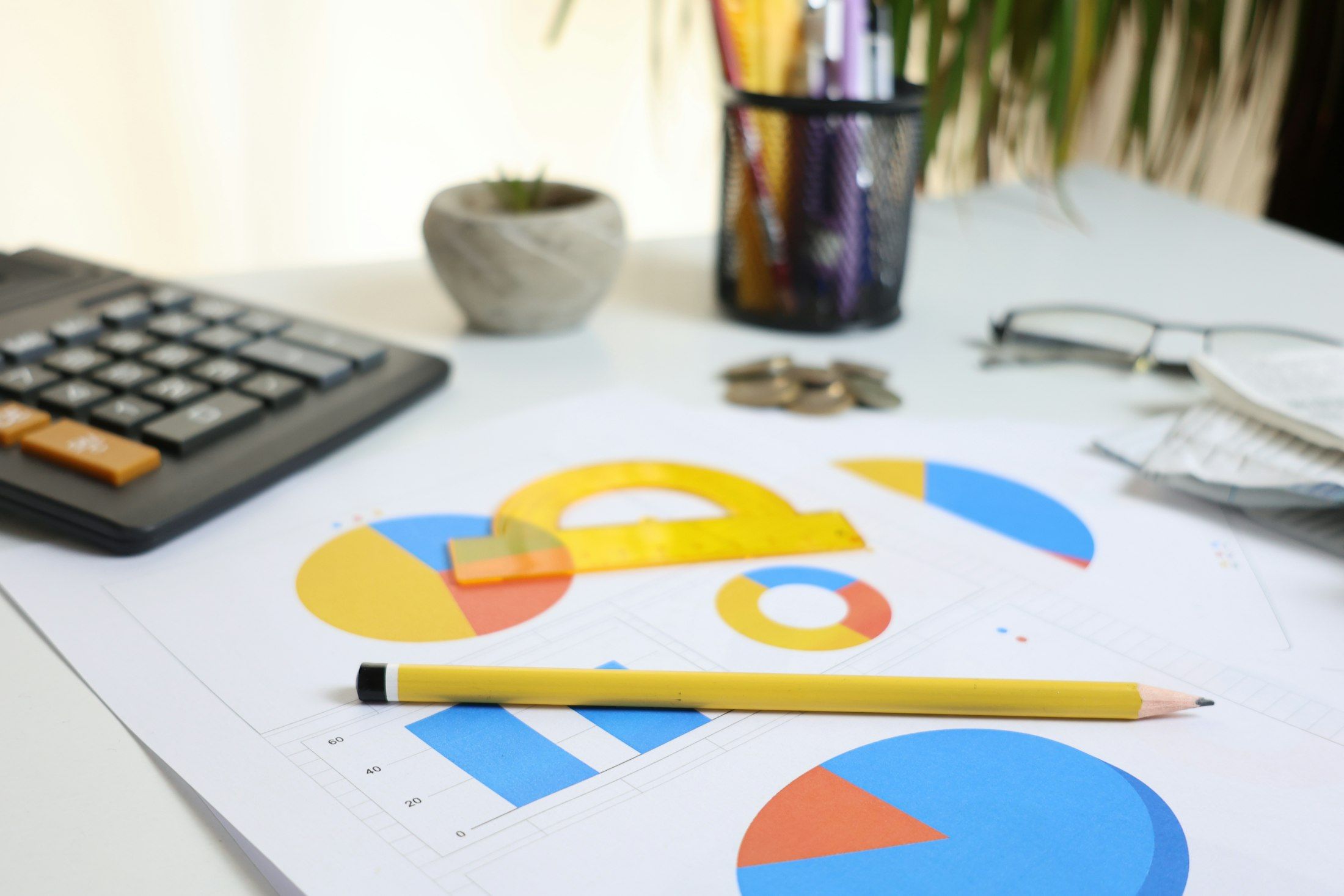 Calculator, charts and pencil on an accountant's desk at Monetaire Accountants Worthing